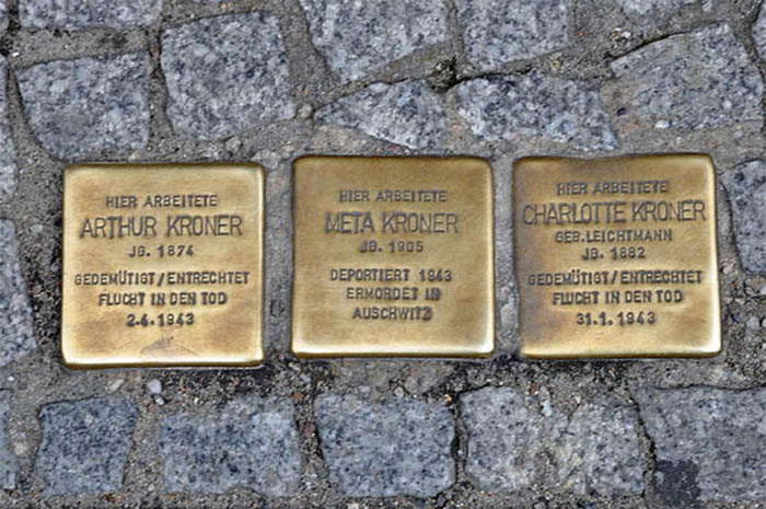 Medallions in the pavement memorialize those who lost their life in the Holocaust